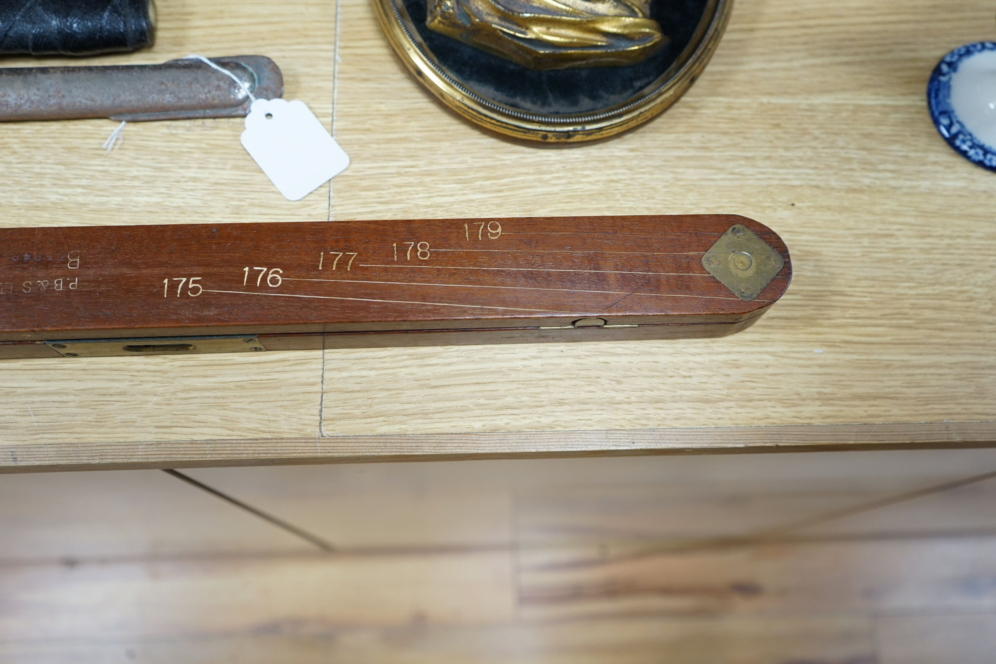 A brass mounted mahogany measure, 126cms long